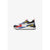 A Puma sneaker in a white, blue, red, and yellow color-blocked design, shown from the side against a light gray background.