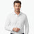 A man wearing a crisp white long-sleeve button-down dress shirt, shown from the chest up against a clean white studio background.