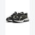 A pair of Puma sneakers in black and beige, featuring the iconic Formstrip design on the side, set against a plain white background.