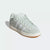 Light gray sneaker with a white sole on a light gray background