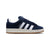 Navy blue Adidas sneaker with white stripes on a white background