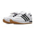 White sneakers with black stripes on a white background