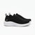 A pair of Skechers black knit athletic sneakers with thick white cushioned soles, shown from a side profile view against a clean white background.