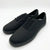 A pair of black canvas lace-up sneakers shown from a three-quarters angle on a clean white background.