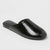 Black leather slide sandal on a light gray background