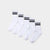 Five pairs of white crew socks with two black stripes near the cuff, arranged diagonally on a light gray background.