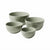 Four ceramic bowls in a matching light sage green color, arranged by size on a plain white background.