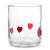 A clear glass tumbler with three red heart designs on the front, photographed against a solid white background.