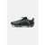 A black Puma soccer cleat with white graphic accents and black studs, shown from a side profile on a light gray background.