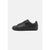 Black leather shoe on a light gray background