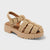 Beige woven sandal with a platform sole on a light gray background
