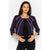A woman modeling a cropped purple jacket with white vertical stripe details, worn over a black top and black pants against a light gray studio background.