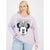 A woman modeling a light purple long-sleeve sweatshirt featuring a large Minnie Mouse graphic on the front, paired with light blue jeans against a plain white studio background.