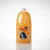 Yellow bottle of Dany Concentrated Shampoo on a concrete surface with a blurred background.