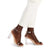 A pair of women's brown leather block-heel sandals with transparent clear straps and clear block heels, shown on a model wearing white trousers against a white background.