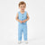 A toddler standing against a plain white studio background, wearing a light blue sleeveless button-front vest and matching light blue pants with white shoes.