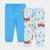 Two pairs of children's sweatpants laid flat on a light gray background. One pair is solid bright blue with a drawstring waist, and the other pair is light blue with a colorful pattern of cartoon vehicles including taxis, fire trucks, and police cars.