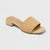 Beige woven sandal on a light gray background