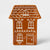 A gingerbread house shaped ceramic container or planter in a glossy terracotta brown color with white icing-style decorative details, shown on a light gray background.