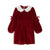 A deep red velvet long-sleeve dress with a white eyelet Peter Pan collar and matching red ribbon bows on the sleeves, shown against a plain white background.