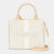 Bebe brand cream canvas tote bag with beige handles and a vertical beige stripe, featuring the embossed 'bebe' logo on the front.
