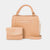 A light beige faux-croc textured handbag set by Bebe, featuring a top handle, a detachable shoulder strap, a gold-tone chain, and a matching small wallet pouch in front, all on a light gray background.