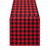 A red and black buffalo plaid table runner shown flat against a solid white background.