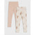 Two pairs of children's leggings laid flat on a light gray background. The left pair is a solid pale blush pink.