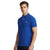 A man wearing a royal blue short-sleeve polo shirt with a small embroidered polo player logo on the left chest, photographed against a plain white background.