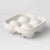 A white silicone mold tray with four oval cavities, shown empty on a light gray studio background.