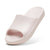 A single Puma slide sandal in a pale pink color, shown from a three-quarters angle on a white background.