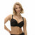 A blonde woman modeling a black wireless bra against a plain white background.
