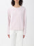 Person wearing a light pink sweatshirt with a logo on a white background