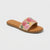 Beige sandal with gold buckle on a white background