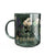 A dark green glass mug featuring a botanical illustration of flowers and the 'Harry Potter' logo printed in gold near the bottom, shown on a clean white background.
