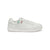 A white leather low-top sneaker with white laces, a thick white sole, and a small green and red striped accent on the side, shown against a plain white background.