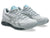 Pair of gray athletic shoes with blue accents on a white background