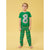 A young boy wearing a green short-sleeve pajama top with a large gray number 8 graphic and matching green pajama pants with a colorful car print, standing against a solid yellow background.