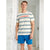 A man wearing a cream-colored short-sleeve t-shirt with blue and red wavy stripes and the brand name 'S. LEEPIEWAR' printed across the chest, paired with bright blue shorts, standing in a doorway.