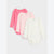 Three long-sleeve baby bodysuits in pink, light pink, and off-white, arranged in a diagonal stack on a light gray background.
