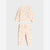 A two-piece children's pajama set featuring a long-sleeve sweatshirt and matching jogger pants in a light cream color with a small pink and green floral print, laid flat on a light gray background.