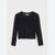 A black long-sleeve crop top with an allover leopard print pattern and a scalloped hem, displayed flat against a light gray background.