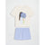 A two-piece children's outfit set featuring a cream-colored short-sleeve t-shirt with a graphic of a girl holding blue flowers, paired with light blue shorts, displayed flat against a light gray background.