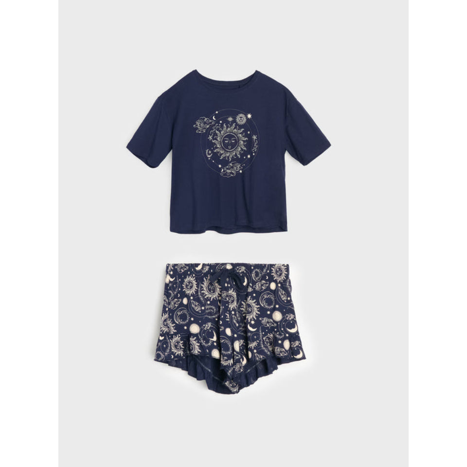 A two-piece children's outfit set featuring a short-sleeve t-shirt and matching shorts in navy blue with white celestial sun and moon prints, displayed on a light gray background.