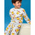 A young boy wearing a light gray heathered pajama set with an all-over Pikachu print, posed against a solid blue background.