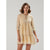 A woman modeling a light yellow tiered mini dress with a delicate blue and white floral pattern, three-quarter sleeves, and a tie-neck detail, set against a plain light gray studio background.