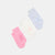 Three pairs of baby socks with grip dots in pink, white, and light blue, arranged diagonally on a light gray background.