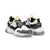 A pair of chunky low-top sneakers in white, black, and gray, featuring bright orange pull tabs and laces, with 'DARK SEER' branding on the side.