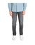 Person wearing a light blue shirt, gray jeans, and white sneakers on a white background