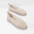 A pair of beige crochet slip-on shoes with braided jute soles, displayed on a clean white background.